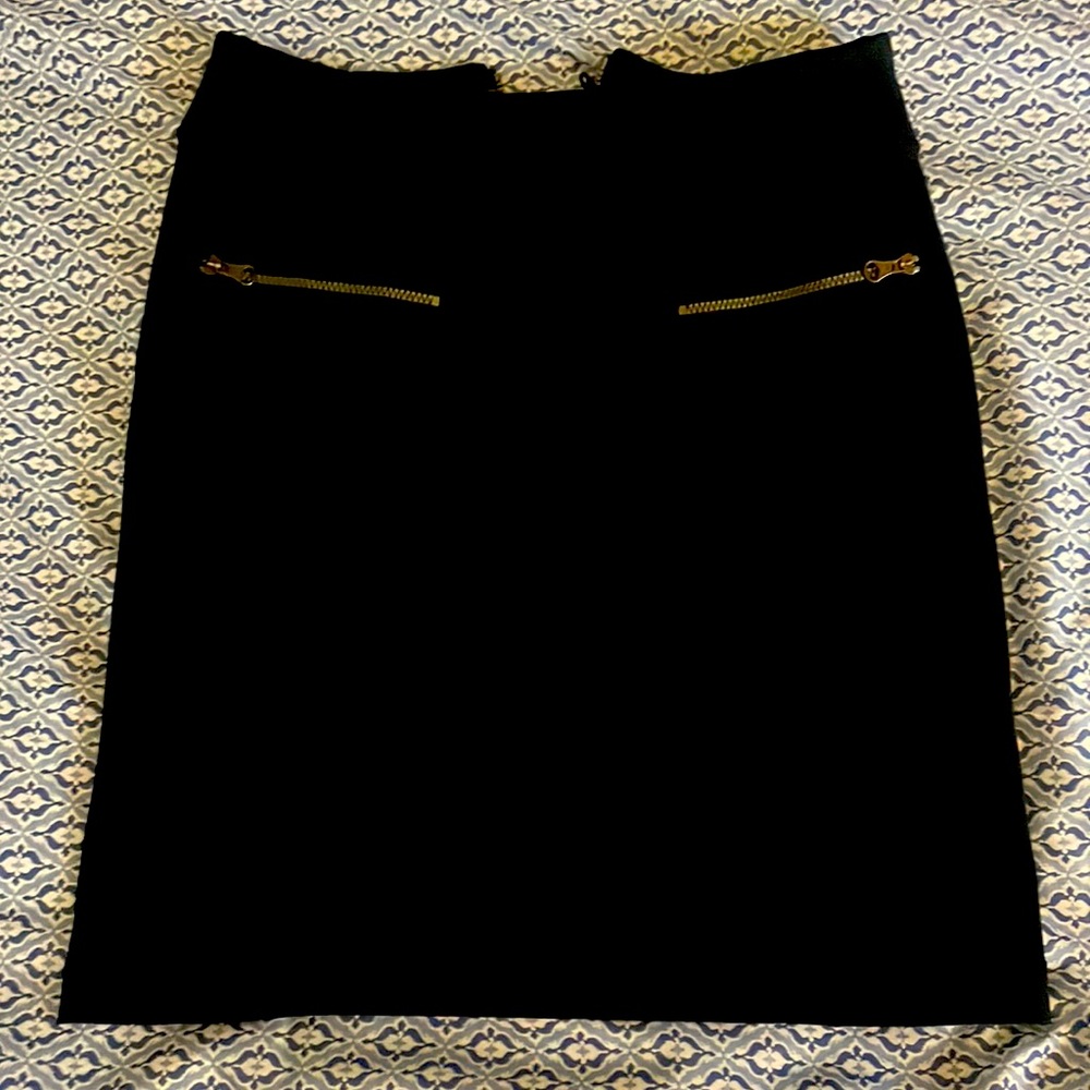Adorable lululemon stretchy moto skirt. Never worn without tags. Size 4, black